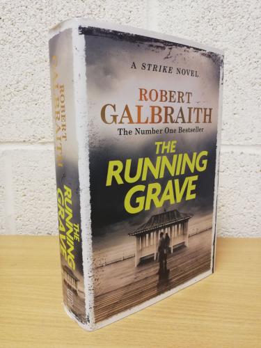 `The Running Grave (7th Cormoran Strike Novel)` - Robert Galbraith (J. K. Rowling) - First U.K Edition - First Print - Hardback - Sphere - 2023