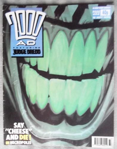 `2000 A.D. Featuring Judge Dredd` - 15th September 1990 - Prog No.696 - `Say "Cheese" And Die! In Necropolis`.